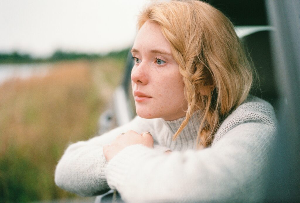An image of a woman looking out in the distance after learning about the side effects of oxycodone withdrawal