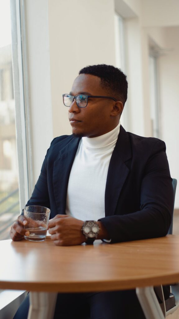 An image of a man staring out of the office window, asking himself what is the DHP drug?